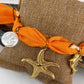 Pulsera de Tela con dijes de Acero Inoxidable y chapa de Oro PAI1018-2