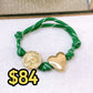 Pulsera Tejida con Dijes de Chapa de Oro COP1750-2